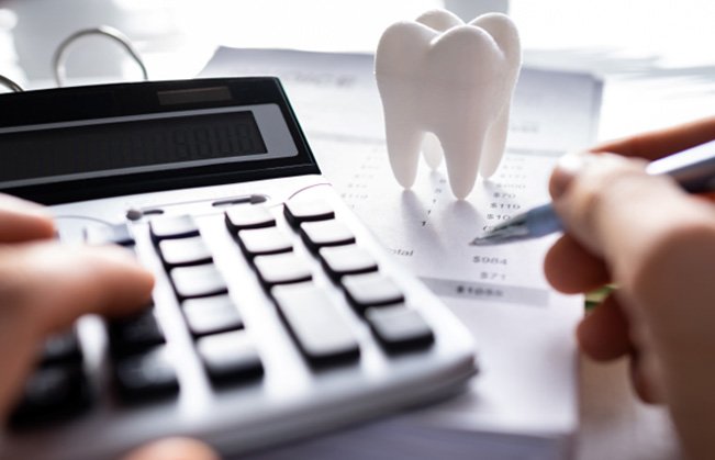 Patient in Covington budgeting for cosmetic dentistry