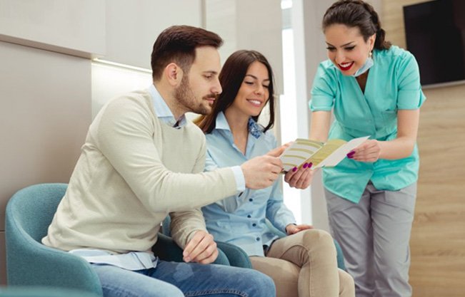 Patient in Covington talking about cosmetic dentistry with dentist