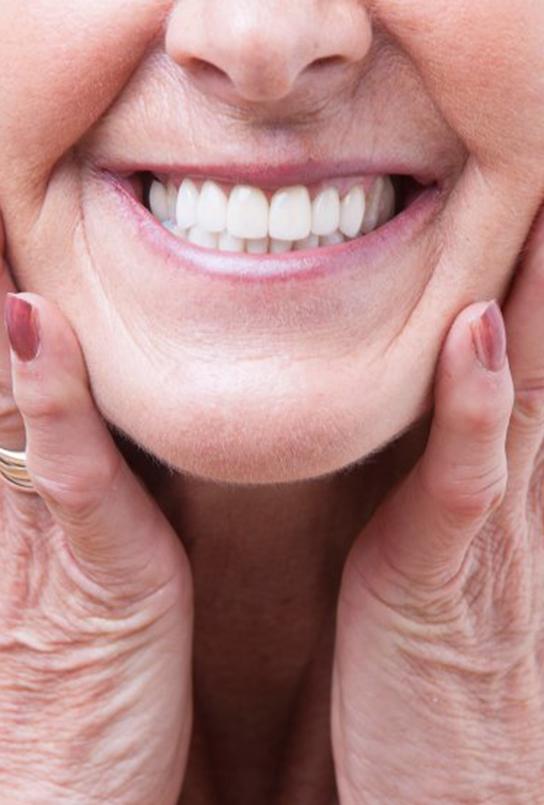 Senior woman smiling to show off her dentures